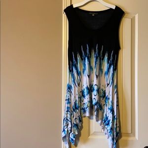 Sleeveless shark-bite hem swing top